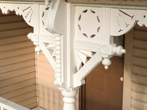 Ornate Victorian bracket with a cut-out medallion and finials