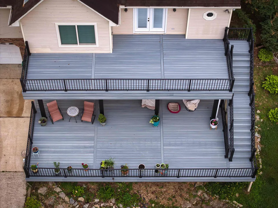 Overhead view of an upper and lower deck in gray composite with black railings