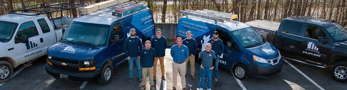 The JACCO Builders crew in front of the company's branded work vans